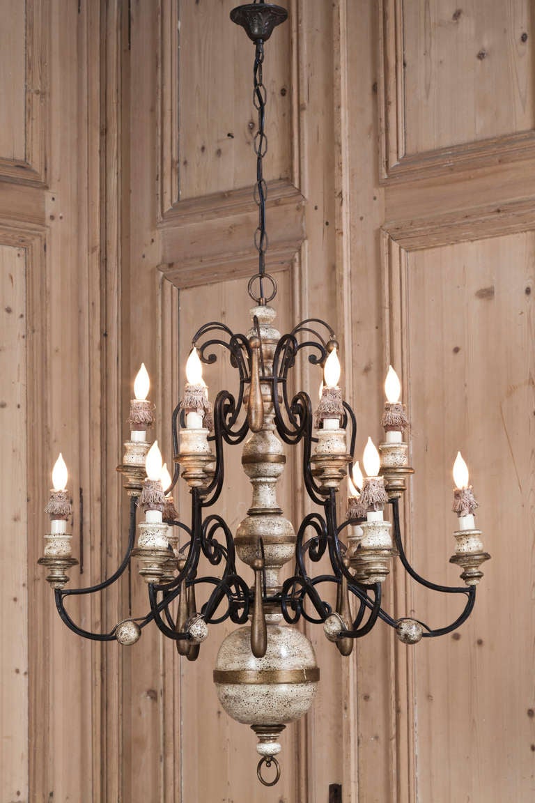 This intriguing chandelier is a marriage of finely wrought iron and turned wood to create a superb Country French effect. Wired to UL Standards, it features some original chain and canopy, ready to hang in your favorite room. 
Nothing adds ambiance