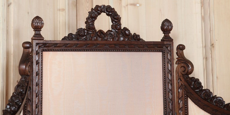 
<b><i>Amazing value - Part of our SPECIAL PURCHASE!</b></i>

Hand-carved from fine French walnut in the manner of Louis XVI, this three-panel dressing screen features intricately sculpted detail across the crown including a floral wreath,