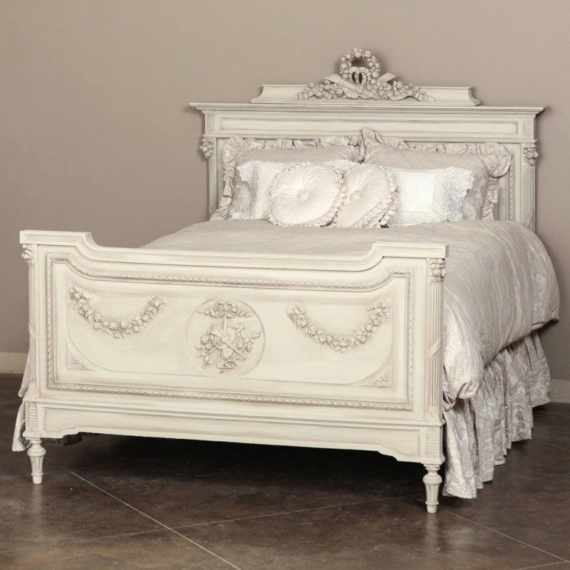 Handcrafted from select French walnut, this Classic bed features architecture and adornment inspired by the ancient Greek and Roman civilizations, and a lovely patinaed painted finish. This splendid example of the style favored by Louis XVI features