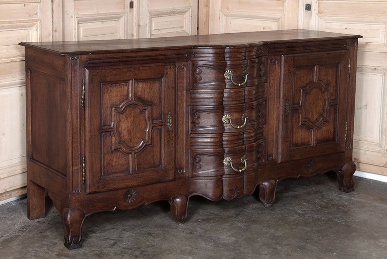 This authentic Country French buffet wash handcrafted from solid, quarter-sawn oak to last for generations in the late decades of 19th century! The antique finish is in very fine condition with warm patina of time. Original forged brass hinges,