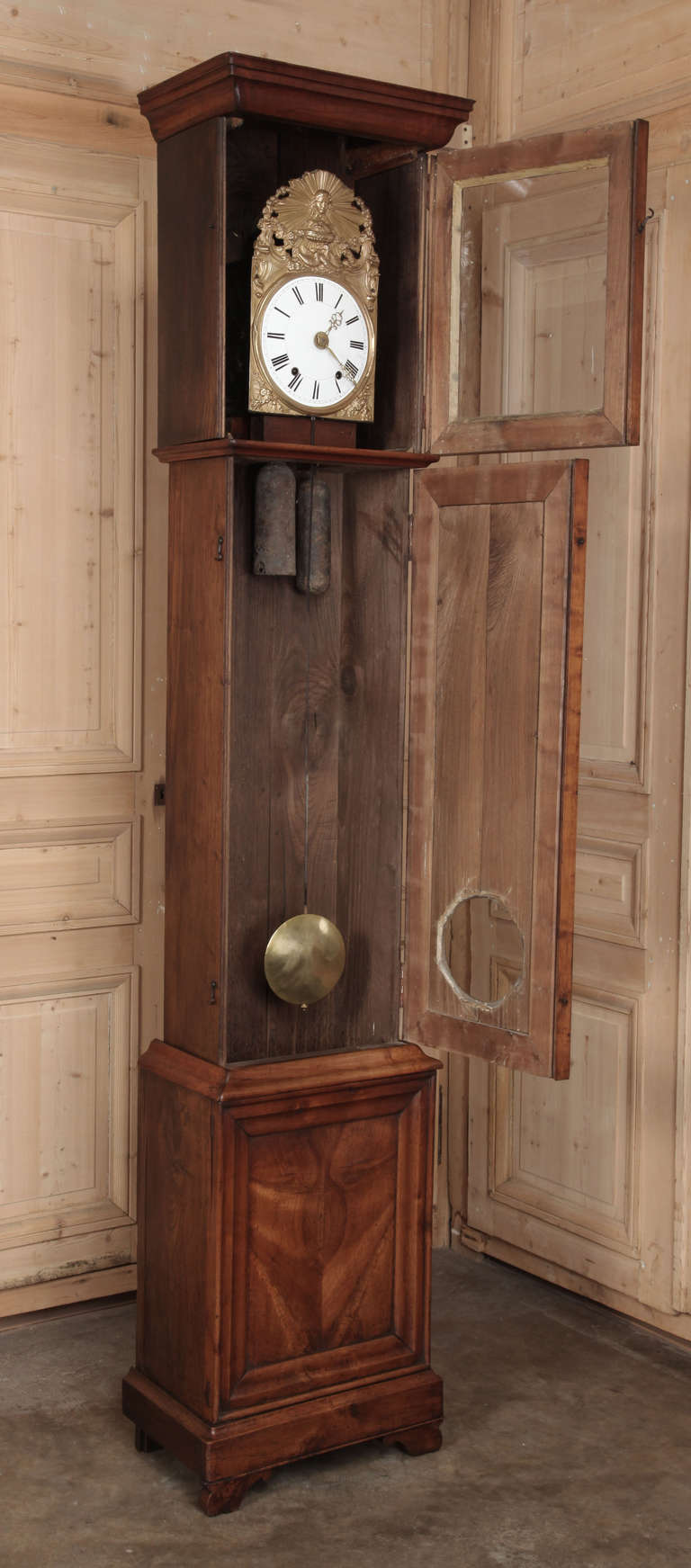 Antique Grandfather Clocks have remained popular for centuries, at once creating a focal point for a room, keeping track of time itself, and providing a lovely furniture accent!  This Antique French Louis Philippe Period Clock has been crafted from