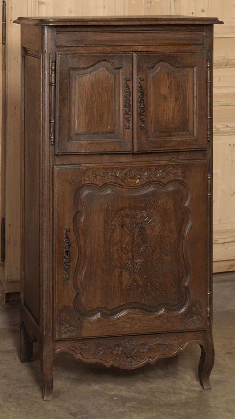 A variation on the classic confiturier, this Vintage Country French Cabinet features two tiers and hand-carved embellishment that will provide copious provincial charm in a diminutive package!
Circa early 1900s.
Measures  50.5H x 26W x 14.5D