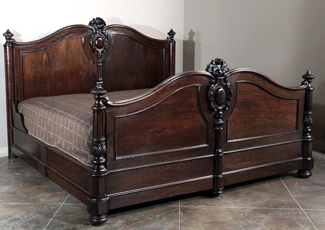 Featuring a transitional style merging the periods between the reigns of Louis Philippe and Napoleon III, this elegant king-size bed was handcrafted from exotic imported rosewood, brought in sailing vessels across the Atlantic in specially