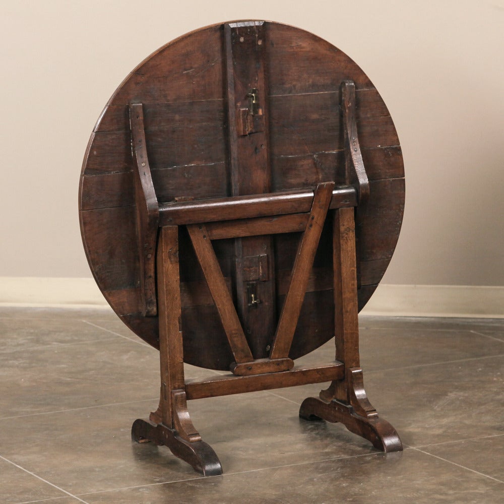 19th Century Country French Rustic Oak Tilt-Top Wine Tasting Table.
Measures: 26 H x 35 in diameter open.
circa 1880s.