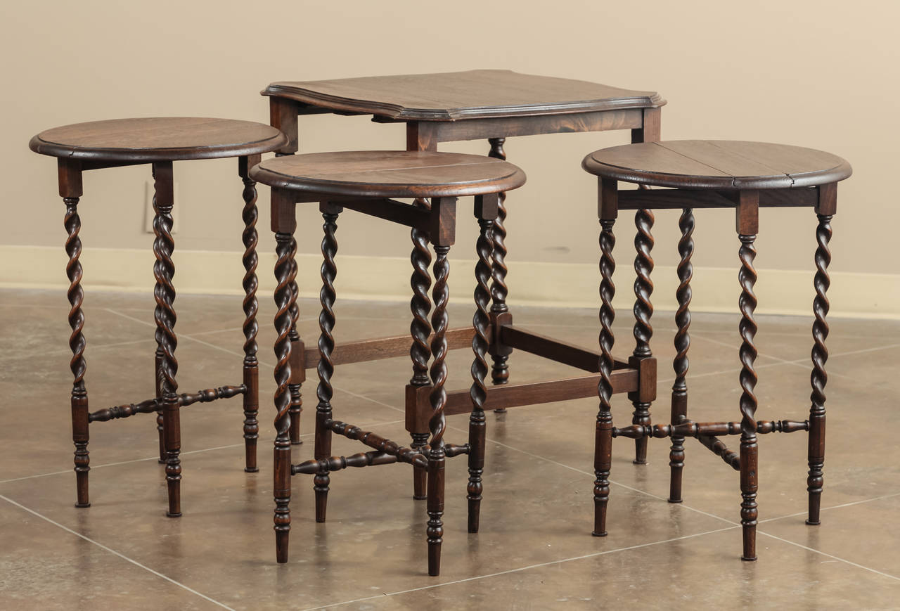 This handsome set of four barley twist nesting tables is the perfect answer to a cozy setting. When one needs only one table, voila! When one needs extra tables to spread around the seating groups, or even into other rooms, voila again! Handcrafted