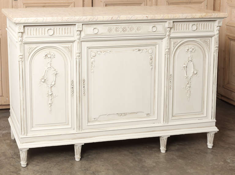 Benchmade and carved from solid oak this handsome Vintage French Louis XVI Marble Top Buffet combines a casual approach with the classical style for a great look that works with a wide variety of decors.  Luxuriously veined marble top adds carefree