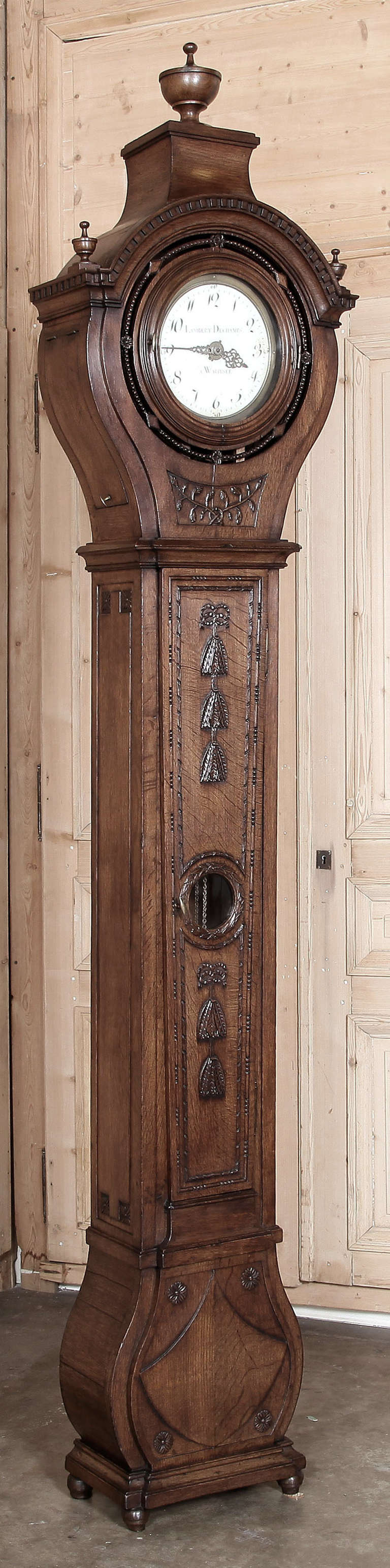 From the master artisans of Picardie comes this elegant Country French clock, styled with the signature rounded clockwork housing at top with belled base at bottom, all sculpted from dense, old-growth French white oak. Hand-carved embellishments