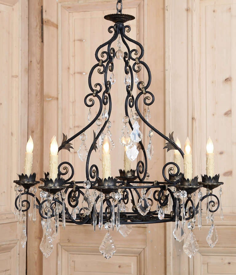 Imagine the hours toiling with red-hot iron to create an intricately scrolled work such as this! Not only does it require artistic ability, but the sheer strength to mold the metal to do one's bidding. For added visual appeal crystals have been