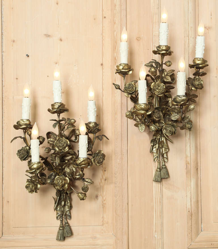 Cast in solid bronze to depict a pair of rose blossom bouquets, this selection is the ideal choice to add just the right amount of ambiance (whether they're switched on or off...) to any room! Painstakingly wired to UL Standards, they were