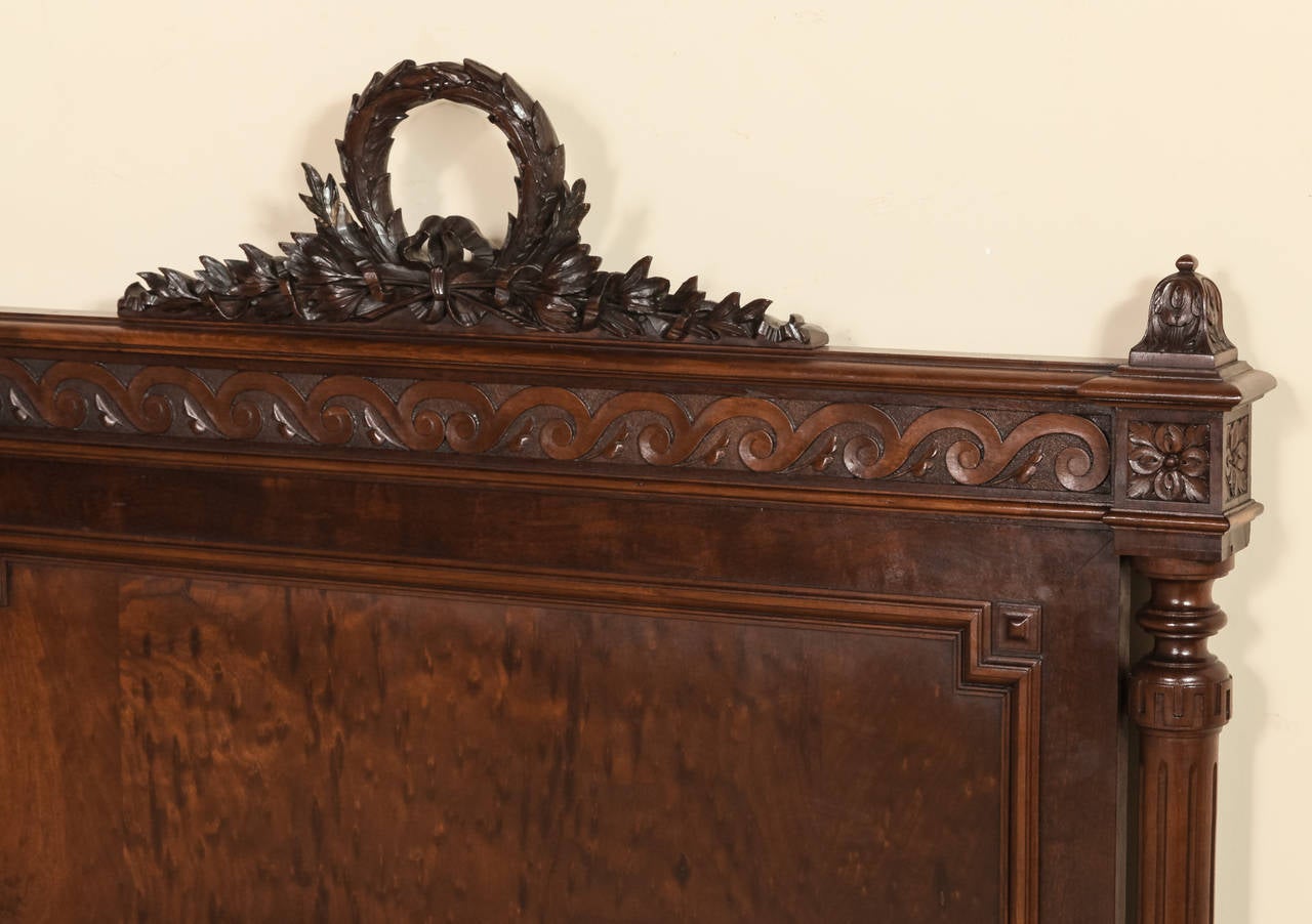 Benchmade from prized mueche mahogany, this gorgeous Antique Louis XVI King Bed features classical styling and architecture. Bold Greek wave motifs on the headboard and footboard also appear along the rails (which have been extended by our clever