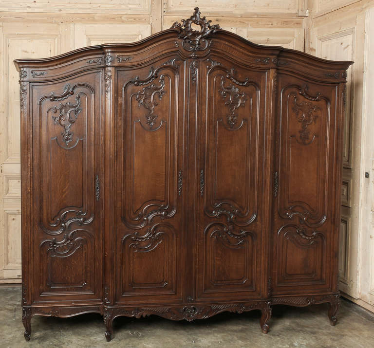 Hand-crafted from solid French oak with a Louis XV style influence for a delightful provincial effect. Copious storage, too! 
Circa early-mid 1900s. 
Measures 89 x 90.5 x 27.5.