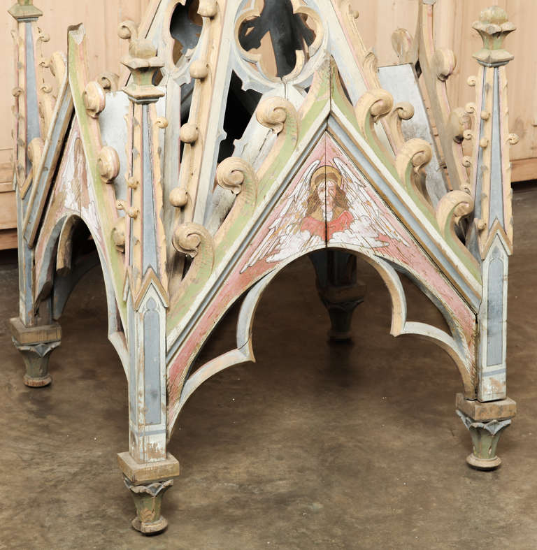 Boasting its original multi-hued painted finish, this Antique French Gothic Painted Shrine Canopy was crafted in the Gothic manner and features numerous examples of traditional Gothic arches and hand painted images of angels.
Circa 1850s.
Measures
