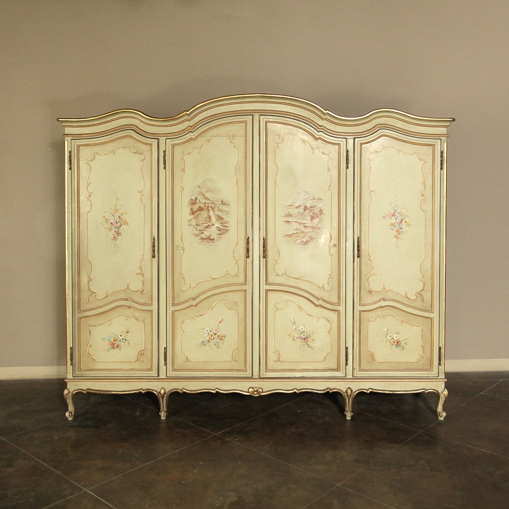 With all the Italian Baroque style of the fabled city of Venice, this Grand Venetian Four-Door Painted Armoire has been hand decorated to perfection, and will lend a splash of color and flair to any room, while providing abundant storage in the