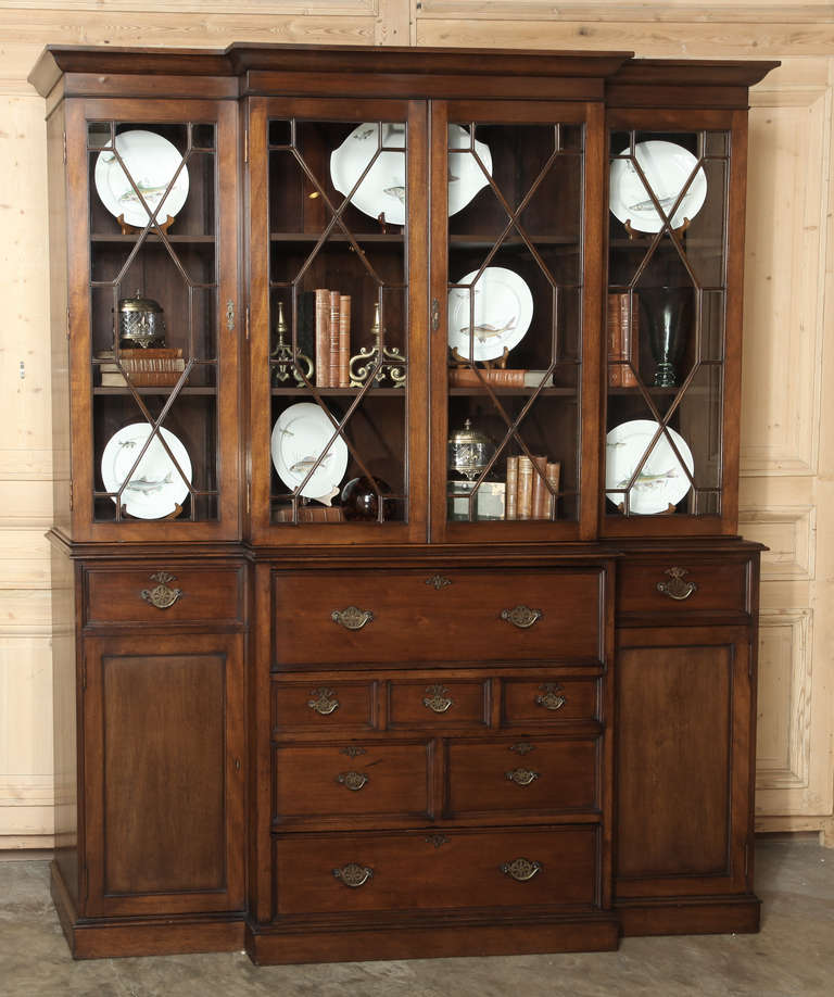 Perfect for the home office, this Antique English Bookcase / Secretary features drawers that open to reveal a secretary desk! 
Circa 1900-1910. 
Measures 88H x 74W x 20D.