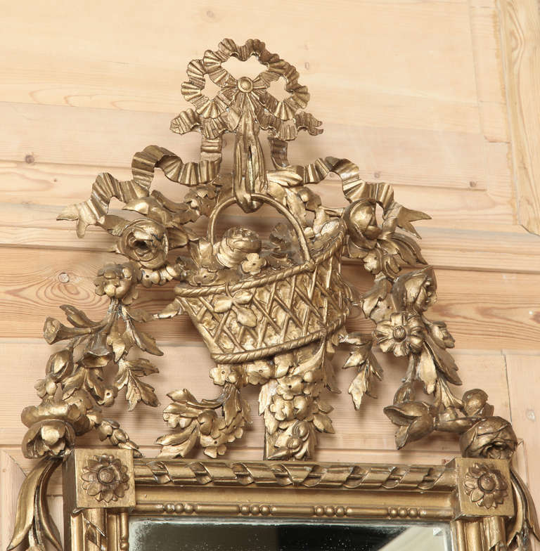 This stunning combination are incredibly narrow and shallow, making this Hand-Carved Antique Neoclassical Giltwood Console and Mirror the perfect selection for a tight niche or between a pair of windows!  An elaborately sculpted floral basket with