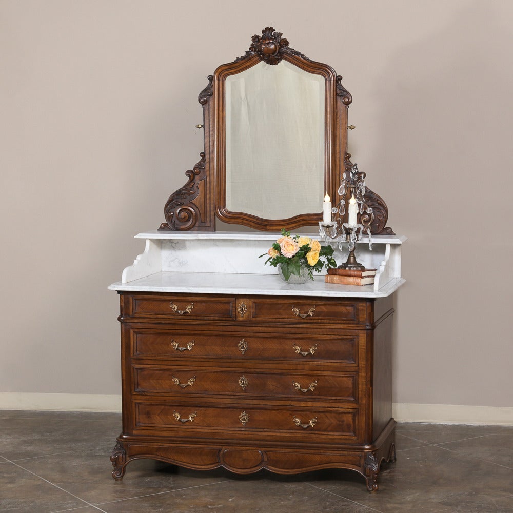 19th century French Regence Carrara marble-top commode washstand was handcrafted during the transition between the Louis Philippe and Napoleon III periods, and represents the epitome of French master craftsmanship! 
circa 1860-1870. 
Measures: 79