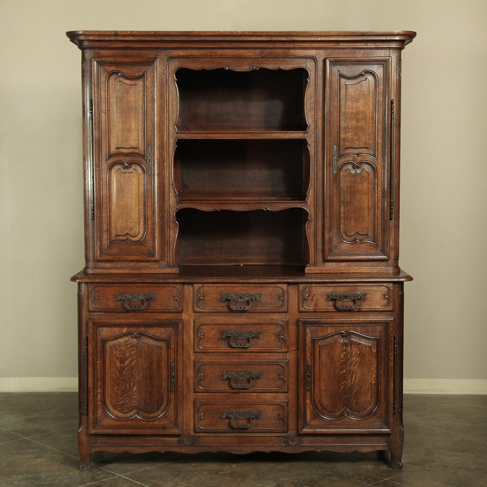 This Classic 19th century country French buffet-vaisselier makes the perfect choice for the casual or Provincial interior, with cabinet space in abundance above and below and open display shelves centered on top to show off your finest! Exquisitely