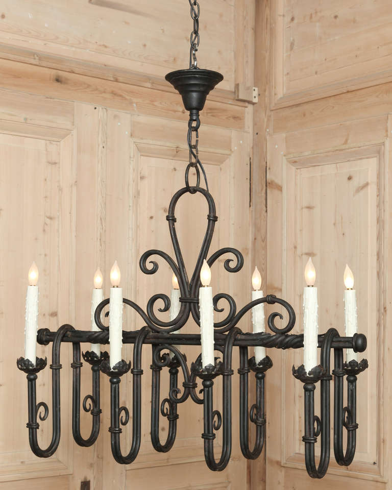 Vintage Country French Fleur De Lys Chandelier was forged from solid iron and features several delightful interpretations of hte timeless Fleur de Lys, a symbol of French kings that actually, according to Italian historians, originated in Fiorenza,