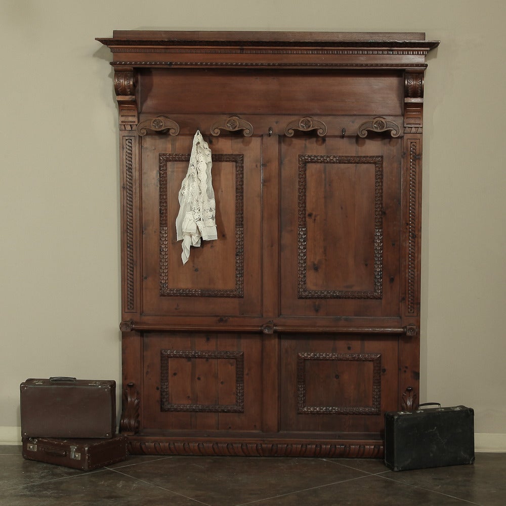 Hand-carved from old-growth pine during the final years of the 19th century, this handsome Italian hall tree was designed to be the first piece inside the door and serve as a repository for one's outer garments including coats, jackets, sweaters,