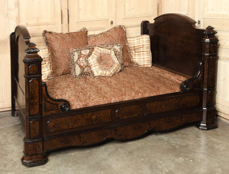 Crafted during an unusual period in France's history, when the leaders of both France and England enjoyed exceptionally cordial relations, this impressive wall bed features bold architecture and exquisite burl walnut with ebonized accents.  Designed