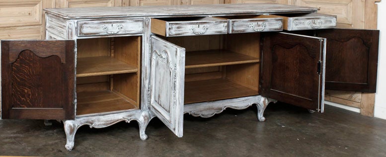 You can store pretty much all of your china, crystal and flatware inside a Country French buffet of this size, maybe with room to spare! Four spacious cabinets and four drawers, all subtly contoured with French scrolls, are supported by a scrolled