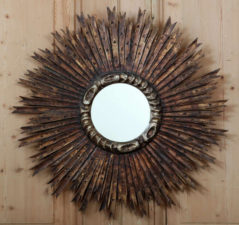 With popularity that shows no sign of waning after well over a century of decorating homes, the sunburst mirror comes in many forms. Today's copies are of course not hand-carved from solid wood then hand-gilded to provide a lustrous and opulent look