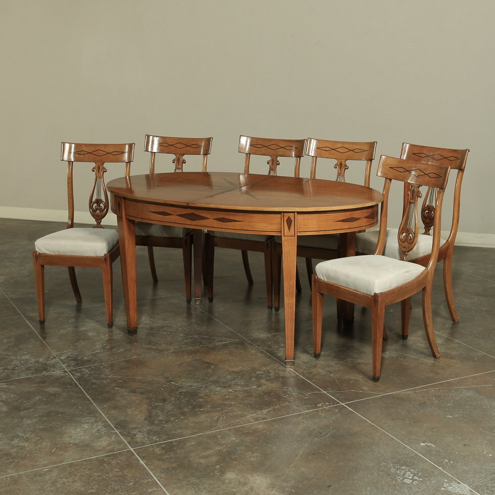 IMPORTANT NOTE:  This set is sold individually on our website and in our Baton Rouge showroom, so to acquire the entire set intact you must act fast!

Hand-crafted from solid cherry wood with inlaid heart walnut, this amazing dining room suite has