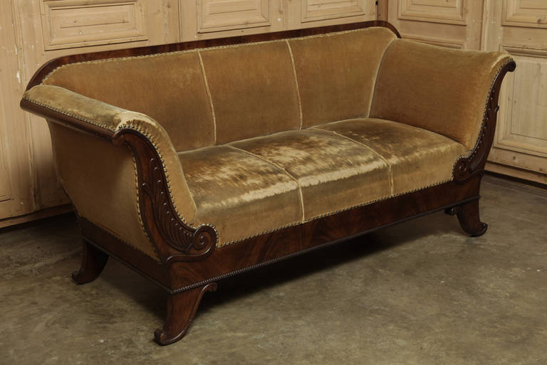 The tailored lines of the Louis Philippe period with graceful detail are the best features of this elegant early 19th century French sofa reflected a simplification of form prevalent during the last Bourbon King's reign. The sheer beauty of the