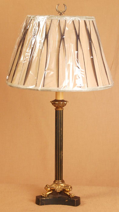 Crafted during the Second Empire, this handsome table lamp was a revival of the First Empire period begun by Napoleon Bonaparte and influenced by ancient Egyptian and Greek architecture & style. Crafted from brass and given a multi-toned finish, its