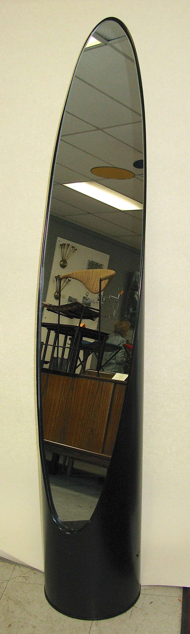 Would make an excellent dressing room accessory or perhaps in a store setting. Very compact size. New mirror. Black paint on metal. Rubber strip around mirror housing and base. Some minor dents and scuffs. Some surface rust along bottom. Really cool