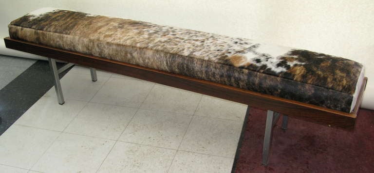 Aluminum legs. Very nice condition. New foam and skin. Firm seat.