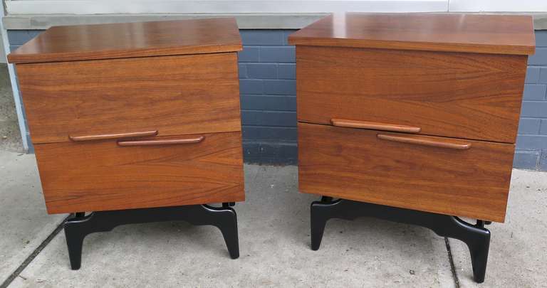 Restored. Black lacquer bases. Simple wood drawers with wood handles. Great graphic wood grain.
