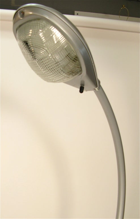 Painted aluminum super guppy lamp on wheels with original cord and plug.The piece is labeled 