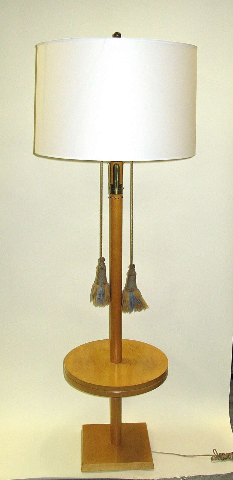 Light colored maple wood. Uses 2 standard socket light bulbs.Each can be individually controlled with the rope pulls. Rope pulls are removable if preferred. Needs appropriate lampshade.Base measures 11 inches x 11 inches. Stamped.