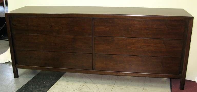 Warm brown finish,with slight reddish undertones. Top 4 drawers have removable dividers.