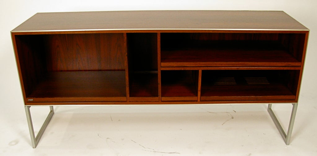 Rosewood and aluminum cabinet with pull-out shelving originally for stereo equipment, but can be used for anything.Beautiful rosewood veneer inside and out.The top right opening is 19 1/4w x 12 3/4 h. Top right opening 26 1/4w x 5 1/2 h. Bottom