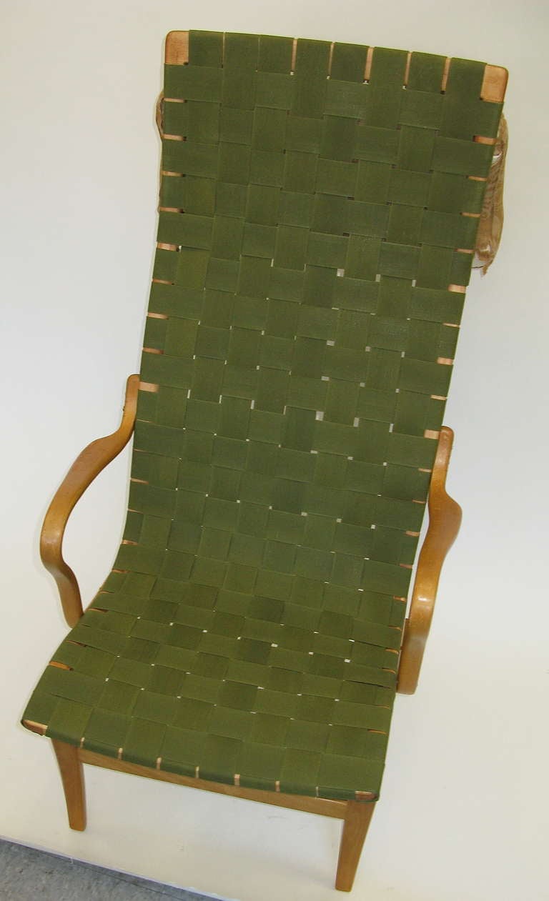 Newly woven seating surfaces with vintage 1950 waxed cotton strapping in military green. All frames restored and in excellent condition. Pillow has been reupholstered with a neutral Belgian linen fabric.