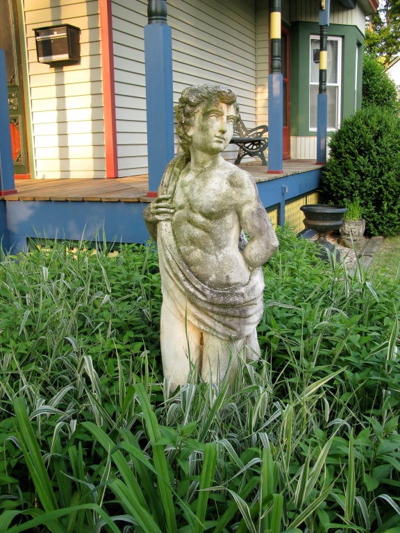 Great looking large, male in a toga,garden fiqure. Beautiful patina and color. Has been in my garden for 8 years..purchased from a garden in Philly. Has a symbol on base of a raised setting sun .Extremely heavy.