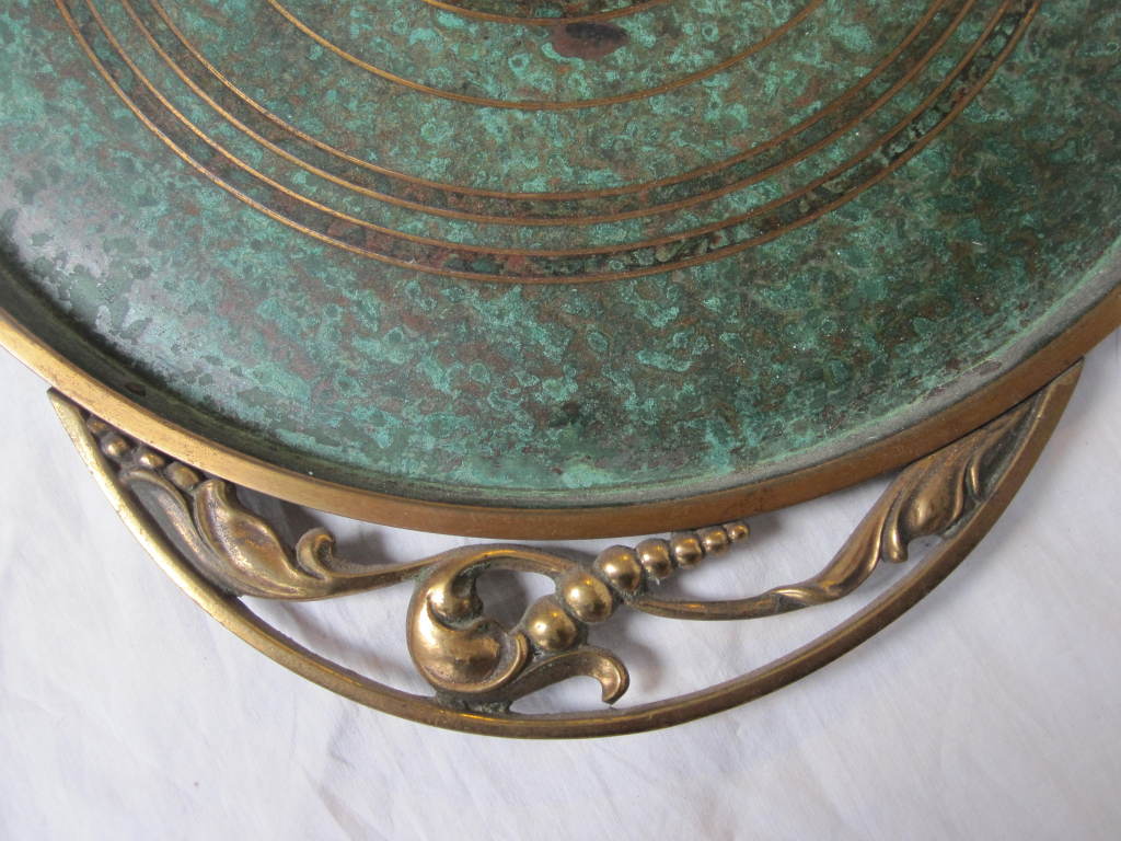 Beautiful bronze tray by Carl Sorensen.
Diameter: 14'' excluding handles.