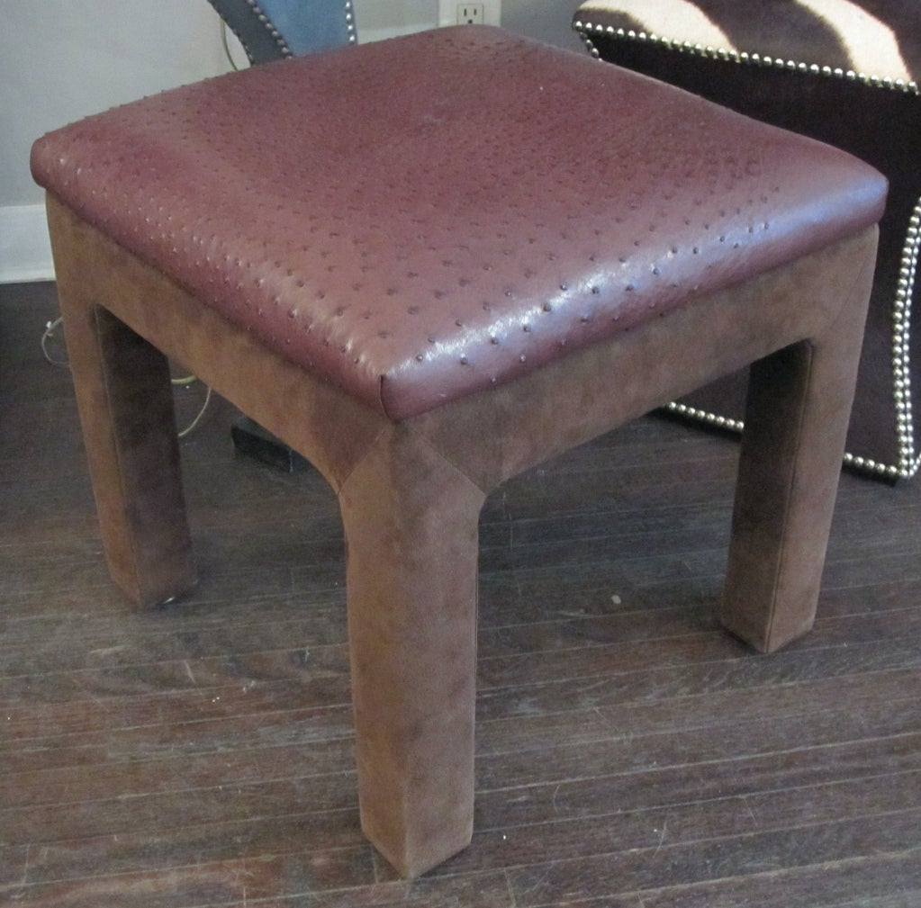 Pair of real ostrich and suede ottomans