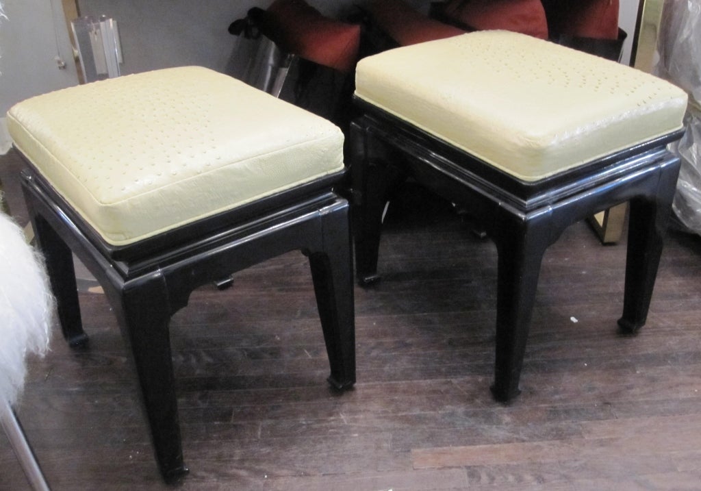 Asian style ostrich and lacquered ottomans