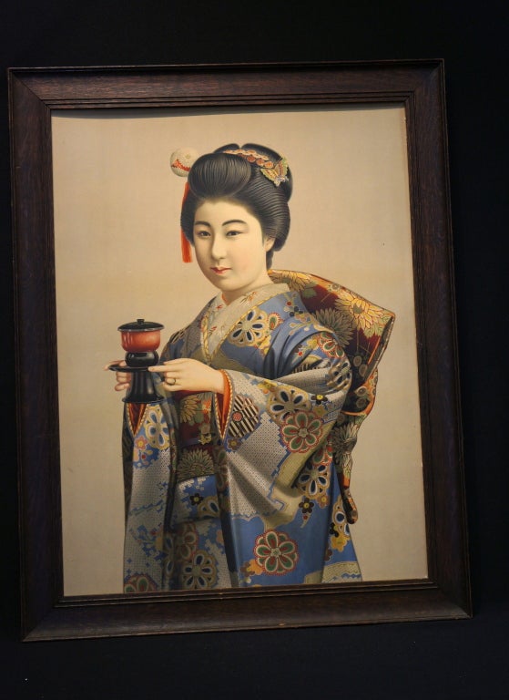 This is a beautiful antique print of a Japanese geisha girl in traditional dress. The colors have remained very rich and the detail is very fine. It is mounted in a dark oak frame. Actual image without frame measures 32