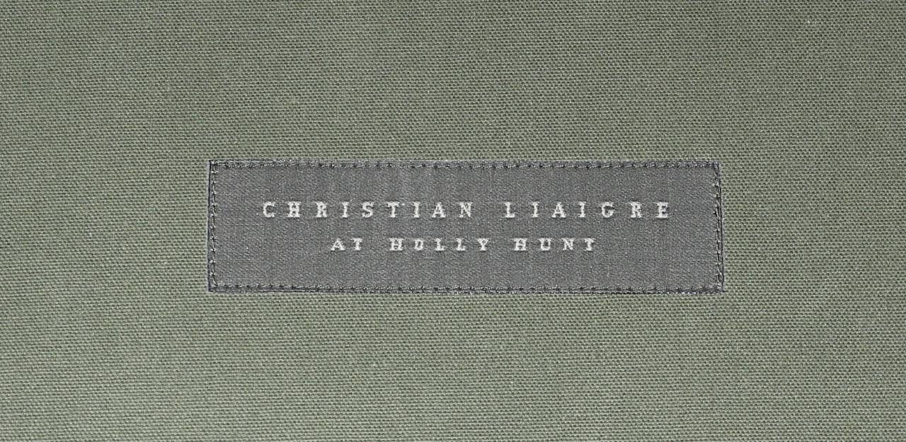A Christian Liaigre soft olive green leather bed detailed in saddle stitch leather on an ebonized wood base. This is the overall measurement of the bed 38