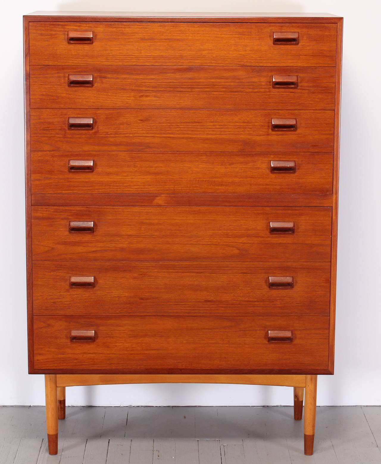 A beautiful tall teak seven-drawer dresser by Børge Mogensen with tapered Birch legs.