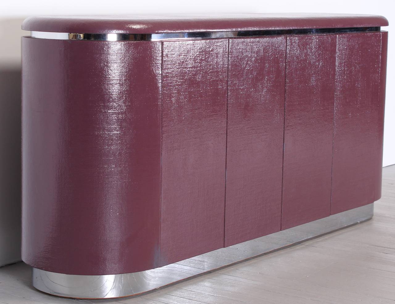 1980s Karl Springer style credenza in purple linen covered case with chrome accents.