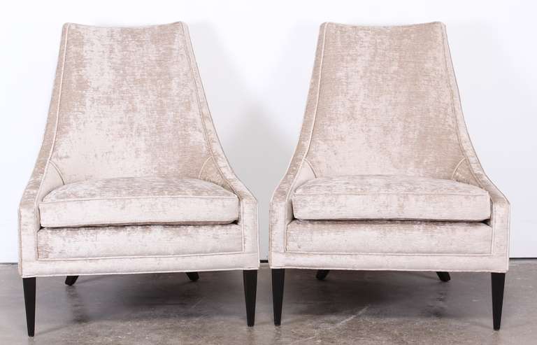 A fabulous pair of 1960's upholstered slipper chairs. Newly upholstered in Duralee 