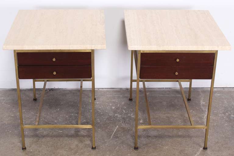 A stunning pair of simple modern line side tables with beautiful travertine marble tops.