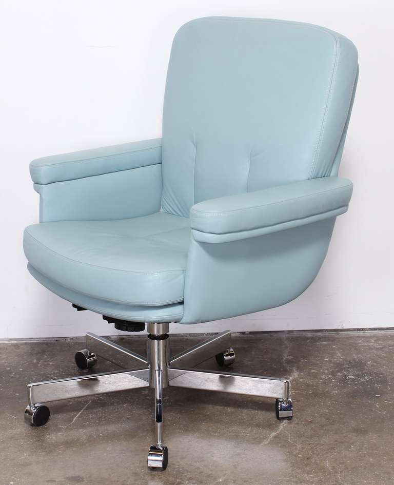 Beautiful blue supple leather executives chair with chrome base and swivel. 
