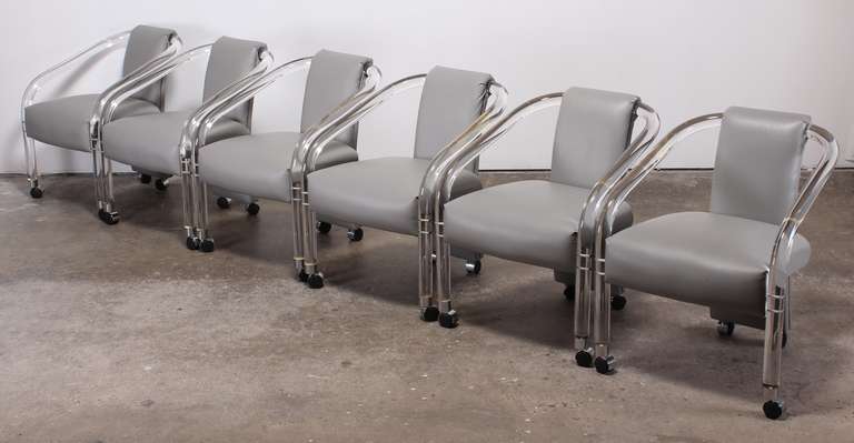 A great set of 6 Lucite arm chairs labeled Hill's Manufacturing Company.