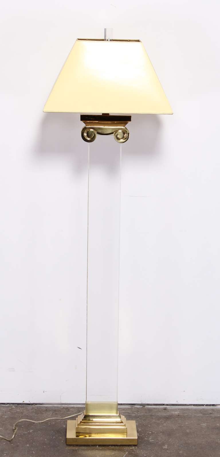 A fabulous and elegant Lucite and brass column floor lamp.